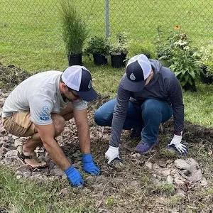 People preparing soil for watershed plants