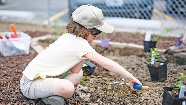 Kid working in a garden