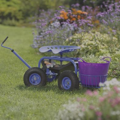 Tractor Scoot in blue next to garden beds with purple Tubtrug being towed in basket
