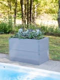 Light blue Putnam Metal Raised Bed 24" x 45" (30" D) planted up at edge of pool