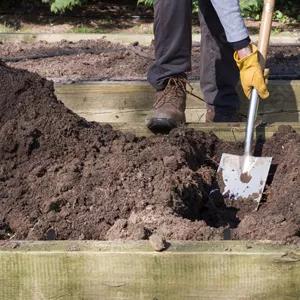 Top off raised bed with compost